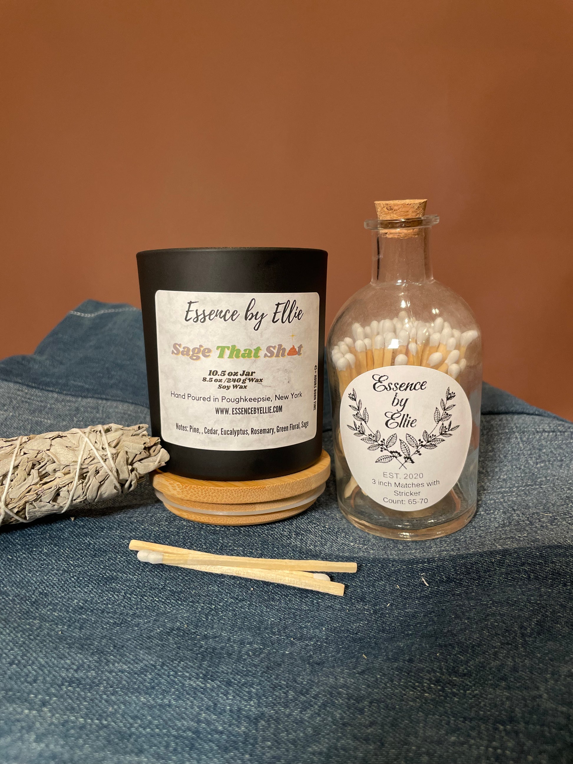 Sage that shit candle has notes of rosemary and sage.  Strong earth notes wooden wick candle